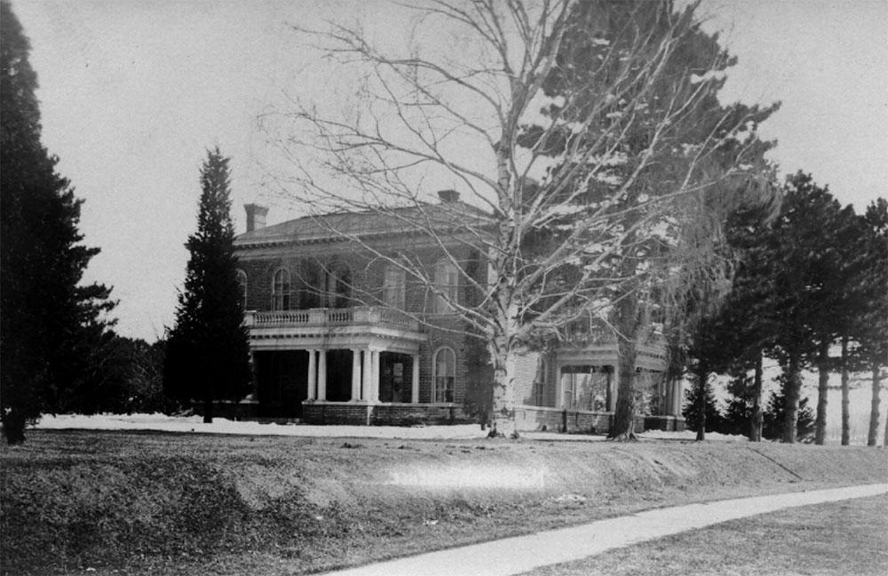 A 1910 postcard of the Gaunt House showcases the mature trees, sidewalk and east porch.